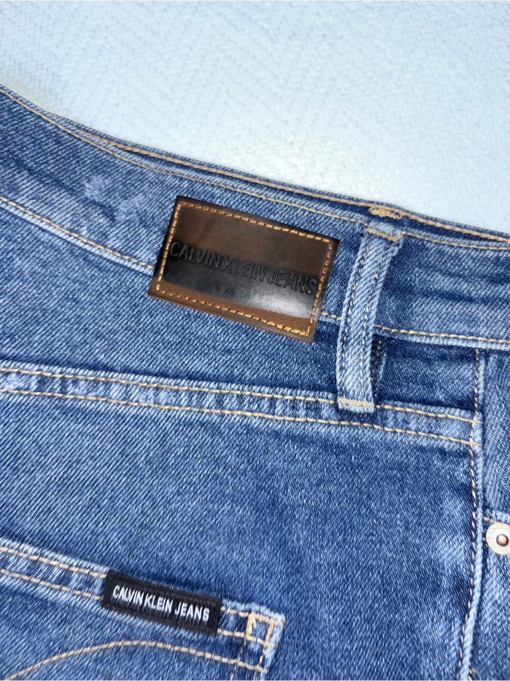 Calvin Klein Women Classic Blue Straight cropped Jeans with Leather Patch